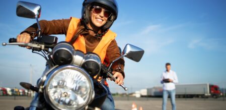 A woman taking the driving test to get her motorcycle license