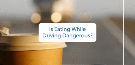 is eating while driving dangerous with a picture of a someone driving with coffee in their hand