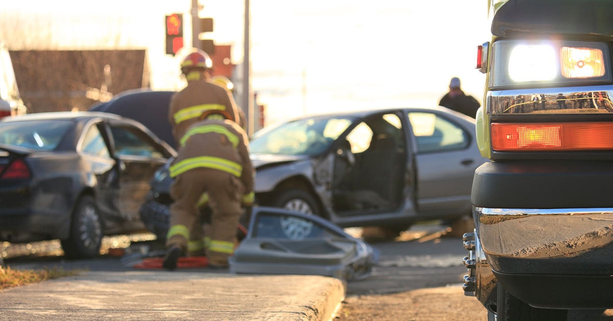 Car crash and firemen are helping