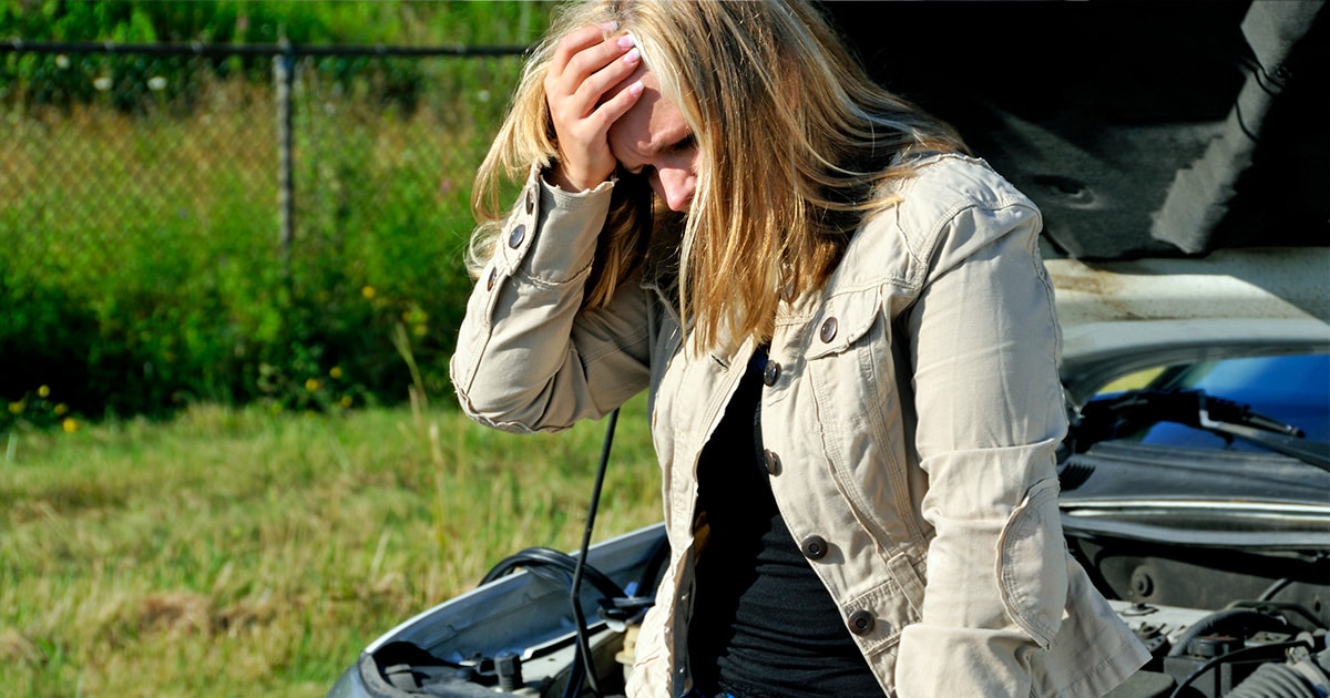 Woman holding her head after a car accident on rural SC road