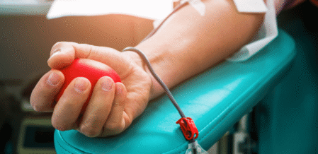 Image of someone's arm as they donate blood