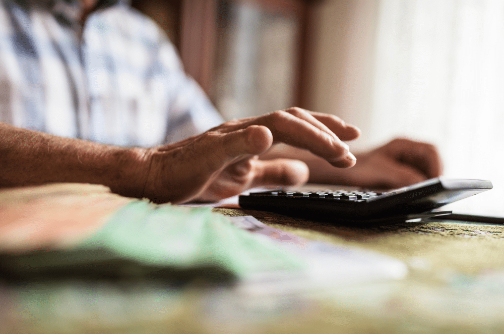 Image of someone typing on a calculator