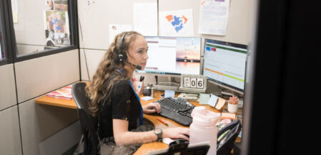 Kylee working in intake with a customer