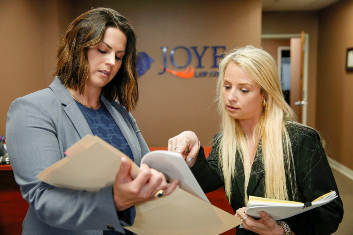 Attorneys in Columbia SC office talking about a case