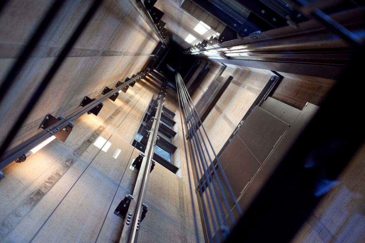Inside a modern empty elevator shaft