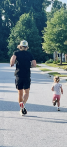John running with his duaghter