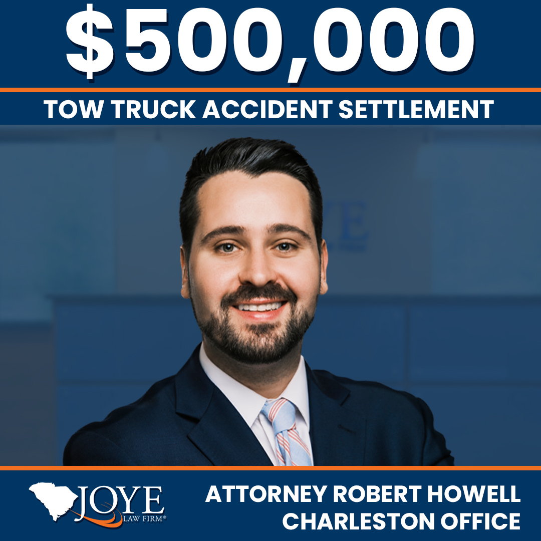A $500,000 settlement for a woman injured in a multi-vehicle crash on I-26 caused by a negligent tow-truck driver, resulting in neck, back, and head injuries.