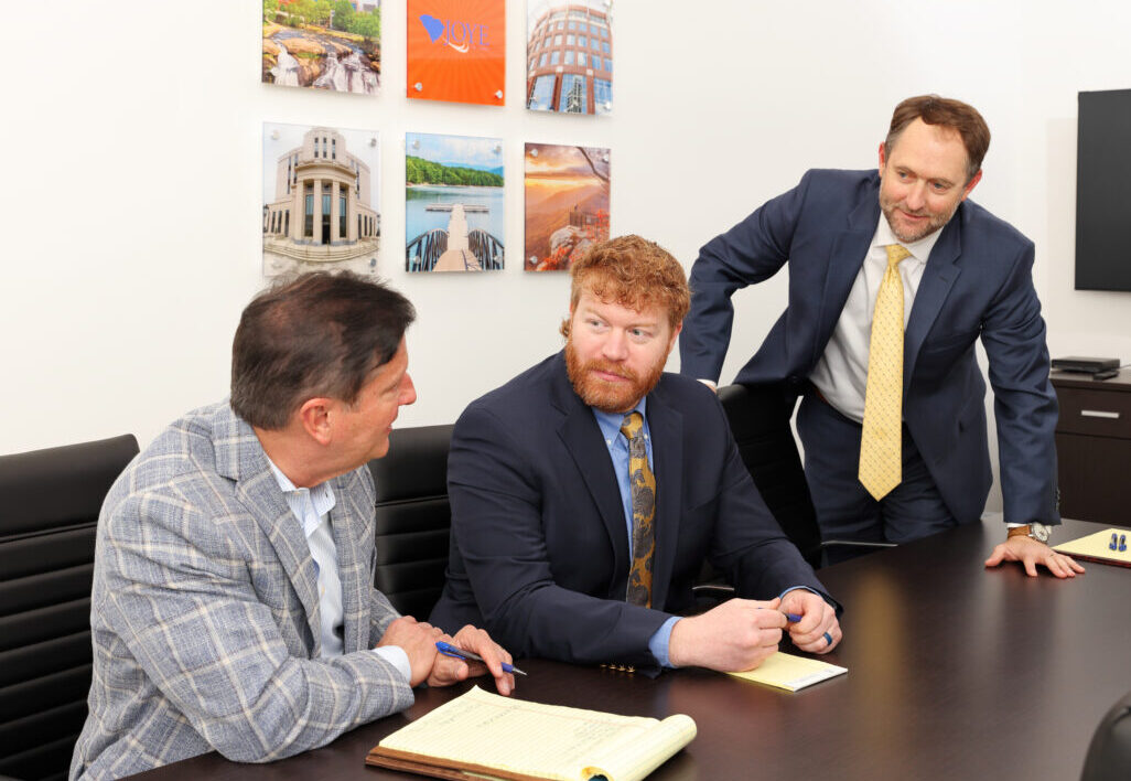 Greenville Joye Law Firm Injury Lawyers attorney Davis Rice and Ian Toomey in a discussion with managing partner, Ken Harrell