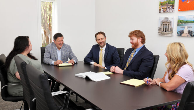 Greenville Joye Law Firm Injury Lawyers attorneys and case managers in the conference room
